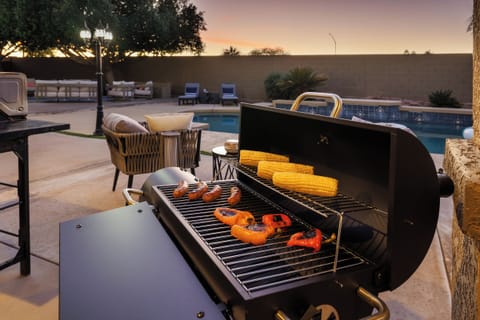 Fire up the BBQ grill by the pool for easy, fun cookouts in the sun.