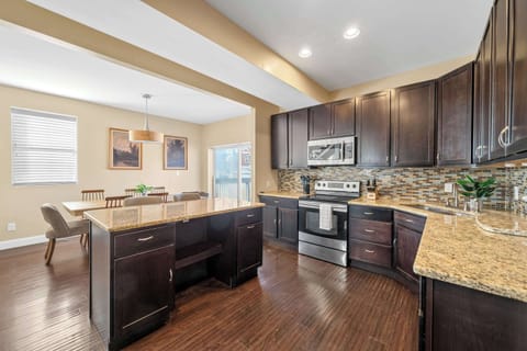 Large sliding doors bring in natural light and lead to outdoor space—perfect for enjoying fresh air during your stay.