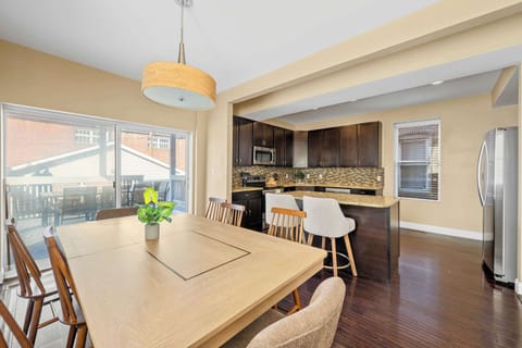 Cook, gather, and entertain with ease in this spacious kitchen featuring granite countertops, stainless steel appliances, and ample seating.