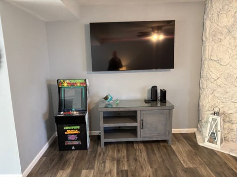 Roku TV, Free high-speed W-Fi, mini arcade game. Board games located in cabinet