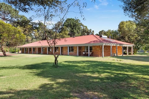 Large and stunning property with a brick style farmhouse.