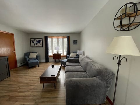 Relax and enjoy the comforts of home in the cozy living room. 