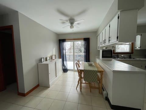 Pull the kitchen table out and find a bench, making this a table for 4 or 5.