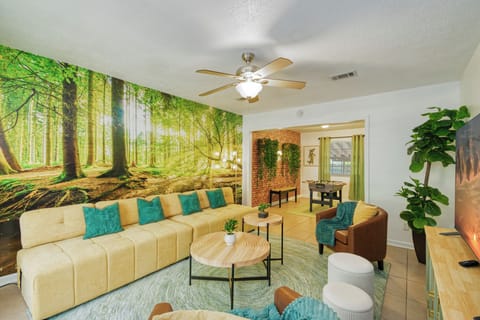 Plush couch and ceiling fan in the living room