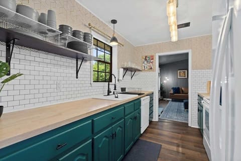 A chef-friendly kitchen complete with all the essentials and stylish open shelving.
