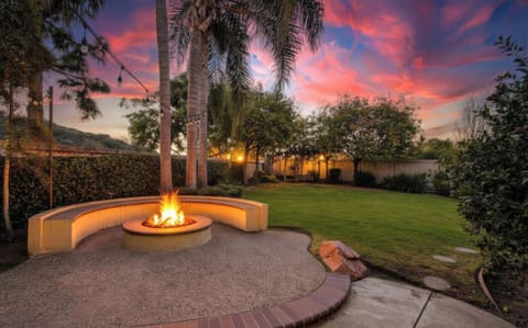 Private backyard with built-in fire pit—perfect for coastal evenings