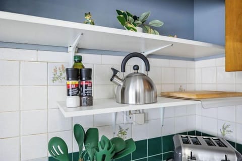 Some of the kitchen amenities include a toaster, electric kettle, cutting board, cooking utensils, and salt & pepper for your convenience.