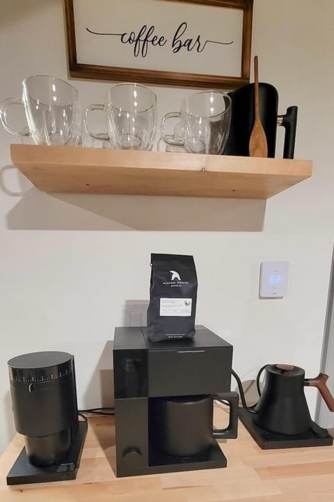 Start your morning at the coffee bar, stocked for easy brewing and slow sips. Whether it’s a quiet sunrise or a cozy afternoon pick-me-up, it’s the perfect spot to pause and enjoy the moment.