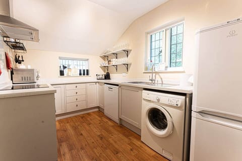 Fully equipped kitchen with dual aspect windows and mod cons
