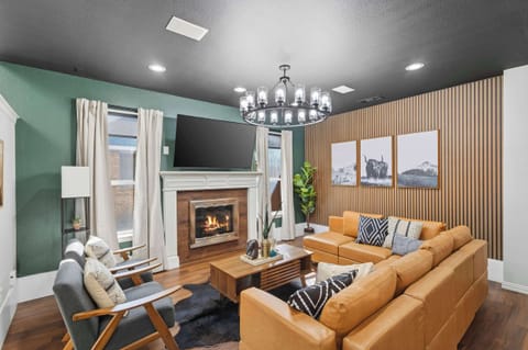 You’ll instantly feel at ease in this upscale living room with its warm features, comfortable furniture, and curated décor to pay homage to our Texas roots.