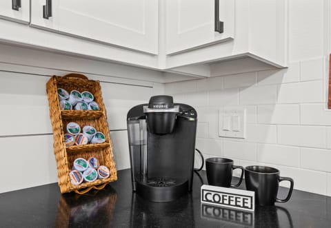 A dedicated coffee station adds a thoughtful touch that makes slow mornings feel especially inviting.