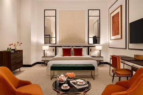 Stretch out in a serene king bedroom with elegant lounge seating.