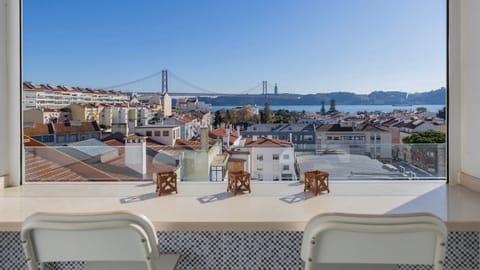Unmatched panoramic views of the Tagus River and 25 de Abril Bridge – your front-row seat to Lisbon's most iconic skyline.
#RiverView #LisbonBridgeView #SunlitStay #Cityscape #BalconyView #Portugal #PT #Lisbon