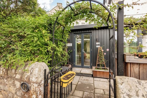 View onto kitchen windows from park