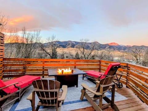 Upper Deck with comfy seating, large propane fire pit, and Pikes Peak views! 