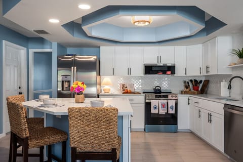 Bright, modern kitchen with spacious island seating and everything you need for effortless group cooking.