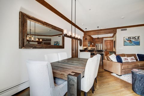 Experience the elegant blend of cozy interiors and modern amenities in this luxury dining space, featuring warm wood finishes and a rustic charm.