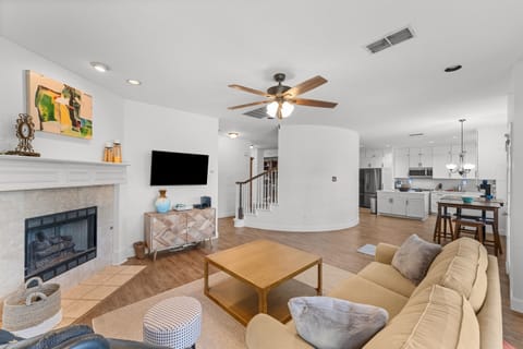 Warm, inviting room with soft seating and a wood-burning fireplace—perfect for unwinding.