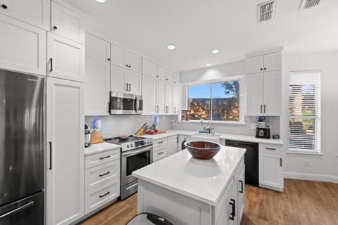 Clean, welcoming kitchen with modern appliances and plenty of counter space.