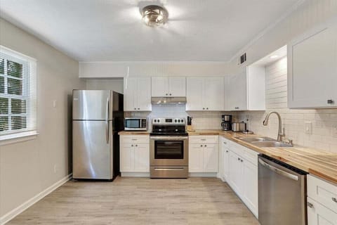 Whip up delicious meals with ease in the spacious kitchen, equipped with stainless steel appliances and all the essentials for your culinary creations!