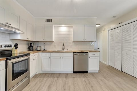 Cook up your favorite meals in the fully equipped kitchen, featuring stainless steel appliances and everything you need for a seamless culinary experience!