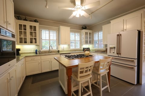 Kitchen with new appliances and island bar seating