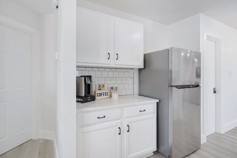 Dedicated coffee bar offering K-cups, sugar options, and syrups.