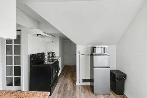 Whip up your favorite meal in this bright, efficient kitchen. With modern appliances and a clean, minimalist design, it is the perfect spot for your morning coffee or a quiet dinner after exploring. Your home away from home.