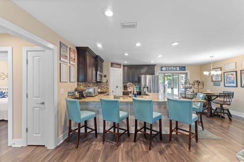 Large kitchen that's fully stocked.  Perfect for cooking a home cooked meal.  Plenty of seating around the large counter for everyone to gather.