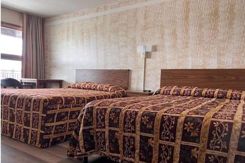 Settle in comfortably with two beds and soft, restful tones.