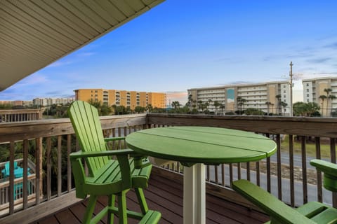 Sunny balcony with comfortable seating and open views.
