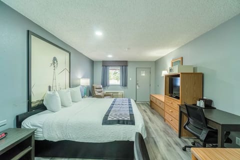 Unwind in a spacious king room with work desk.