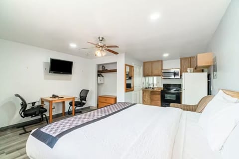 Spread out comfortably with open layout, dining table, and full kitchen.