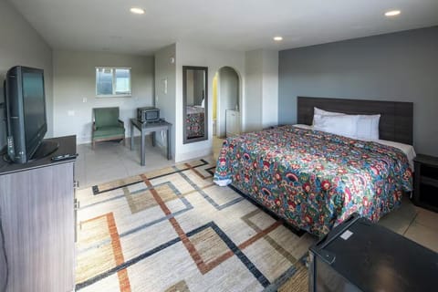 Unwind in a bright, spacious room with plush bedding.