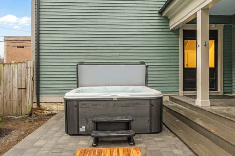 Backyard: After a day of adventures, gather your crew in this private backyard oasis. Soak your cares away in the large, modern hot tub while others relax and chat on the stylish patio seating just steps away.