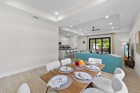 Between the island seating and the dining room table, you can seat ten.