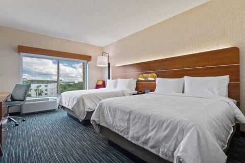 Unwind in crisp linens with calming views by day.