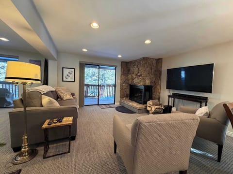 Living room with access to large deck space