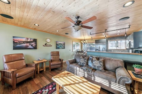 Inviting living area with comfy seating and warm wood ceilings—perfect for relaxing, sharing stories, and enjoying time together after a day out.
