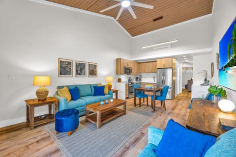 This wide-angle view showcases the thoughtful coastal decor and the generous flow of the unit. With stylish furnishings and modern amenities, it's a true home-away-from-home.