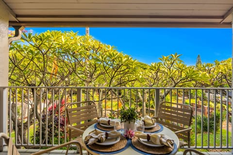 Enjoy your meals al fresco on this spacious, shaded lanai. It's surrounded by lush greenery and fragrant Plumeria, offering a peaceful and private setting for your morning coffee or evening wine.