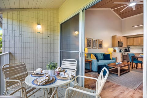 Large sliding glass doors with screens bridge the gap between the cozy living room and the fresh air of the lanai. Keep the doors open to enjoy the gentle cross-breeze throughout the home.