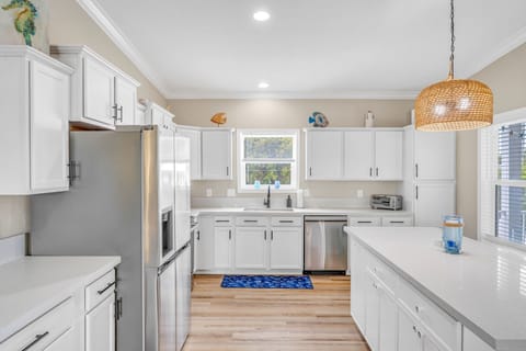 Open-concept kitchen ideal for group stays, with waterfront views.