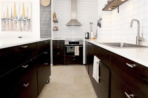 Modern open kitchen is fully equipped with all the appliances