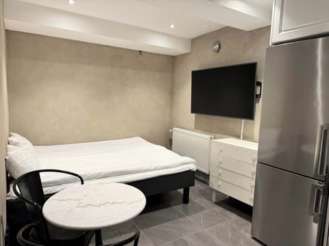 Our apartment has a 160 cm bed and a TV .