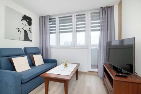 Relax in the stylish living room with a comfortable sofa and modern decor.