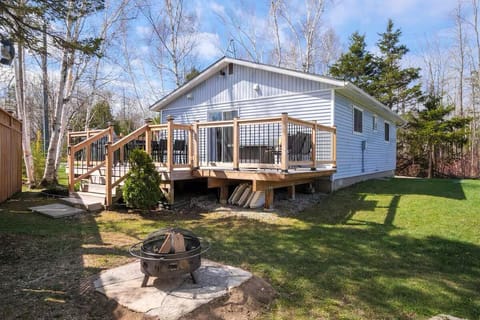 The perfect weekend setup: sunny deck views by day, campfire stories by night.