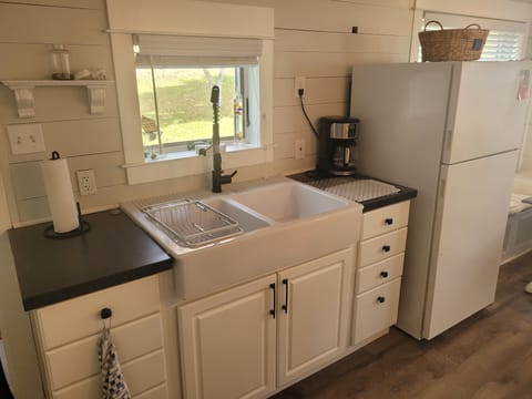 KITCHEN:  Overview of the kitchen, which has all appliances except for a dishwasher.  Also has a good supply of cooking and dining utensils.