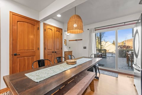 Gather around your rustic dining table where natural light streams through windows, creating the perfect backdrop for memorable meals together.