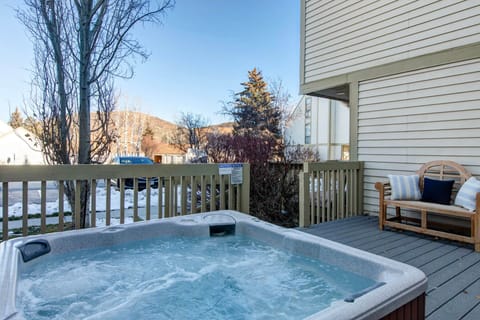 Soak in your private hot tub on the deck, surrounded by mountain views and winter serenity.